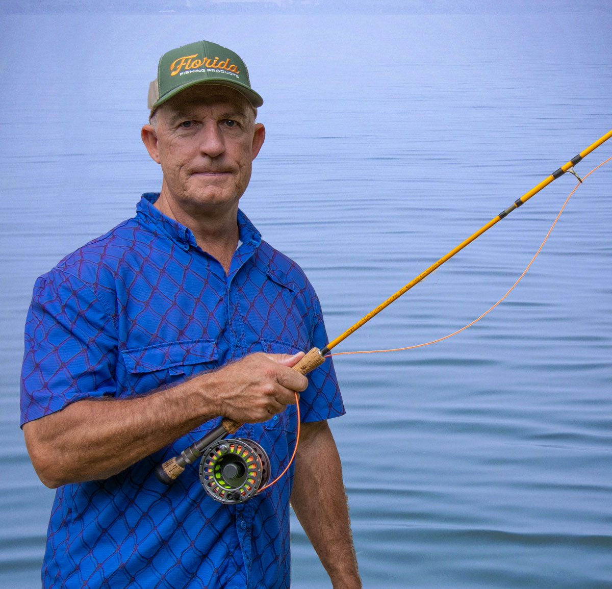 Capt. Chris Myers teaching fly casting on the water